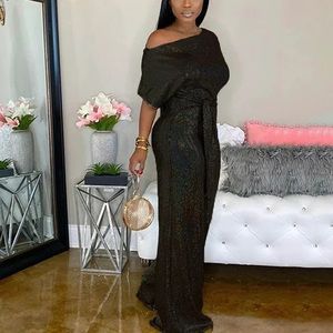 Women’s off shoulder sparkly jumpsuit with high waist and wide leg.